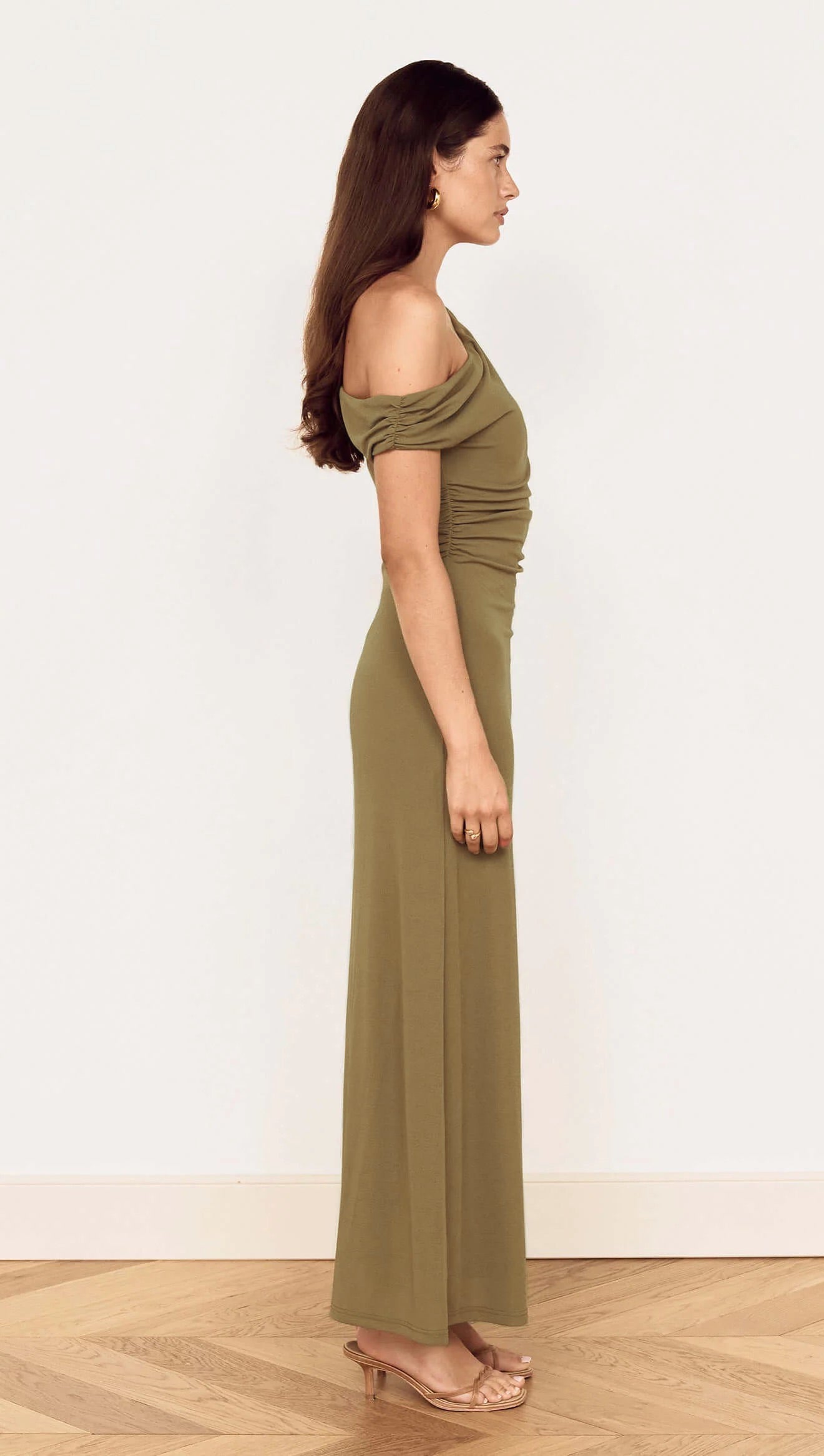 side of a woman wearing Bavaria Khaki Asymmetrical Long Dress from La petite garçonne