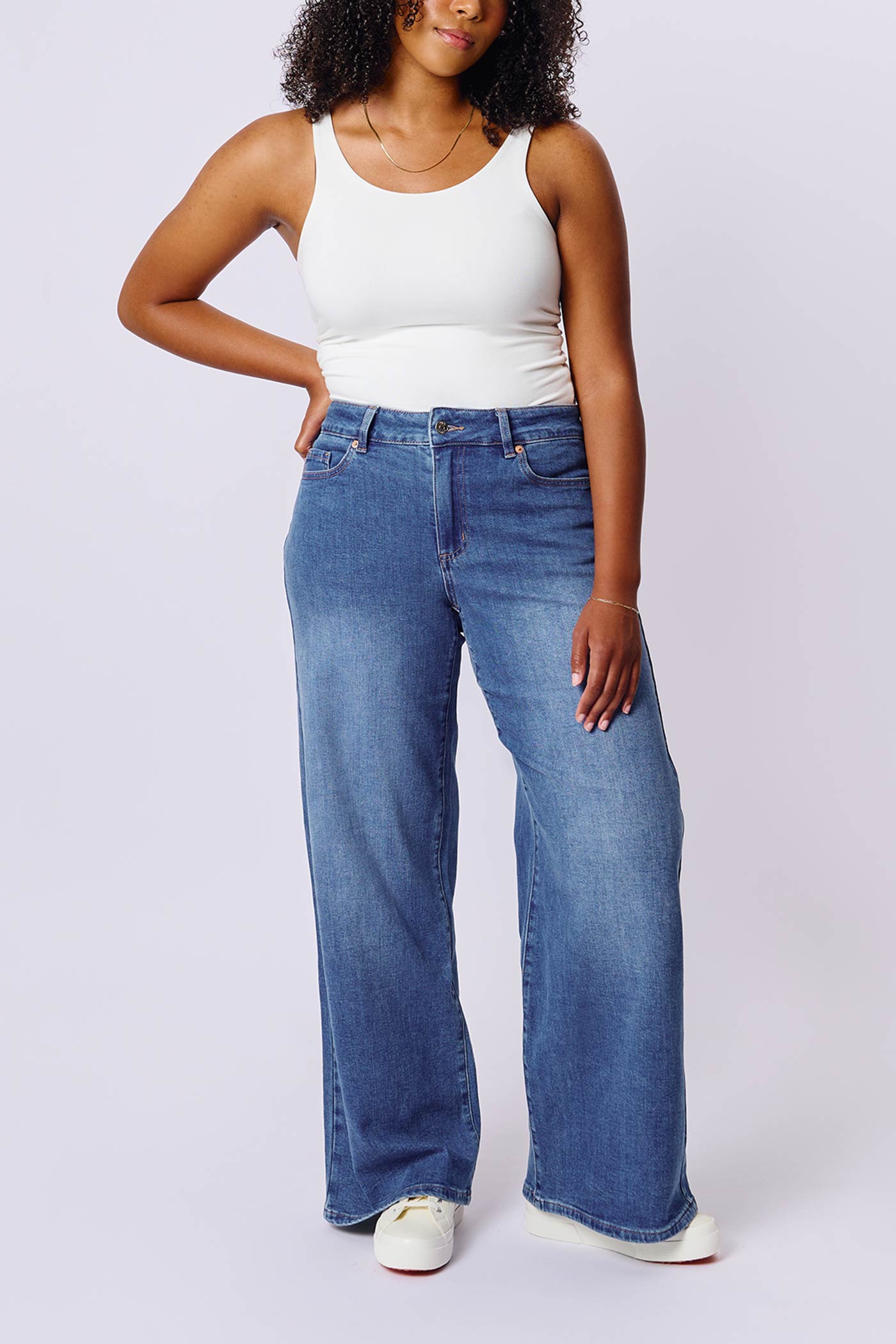 medium size woman wearing Aurora Jeans Blue High-Waisted Wide-Leg Jeans by Dailystory from La petite garçonne
