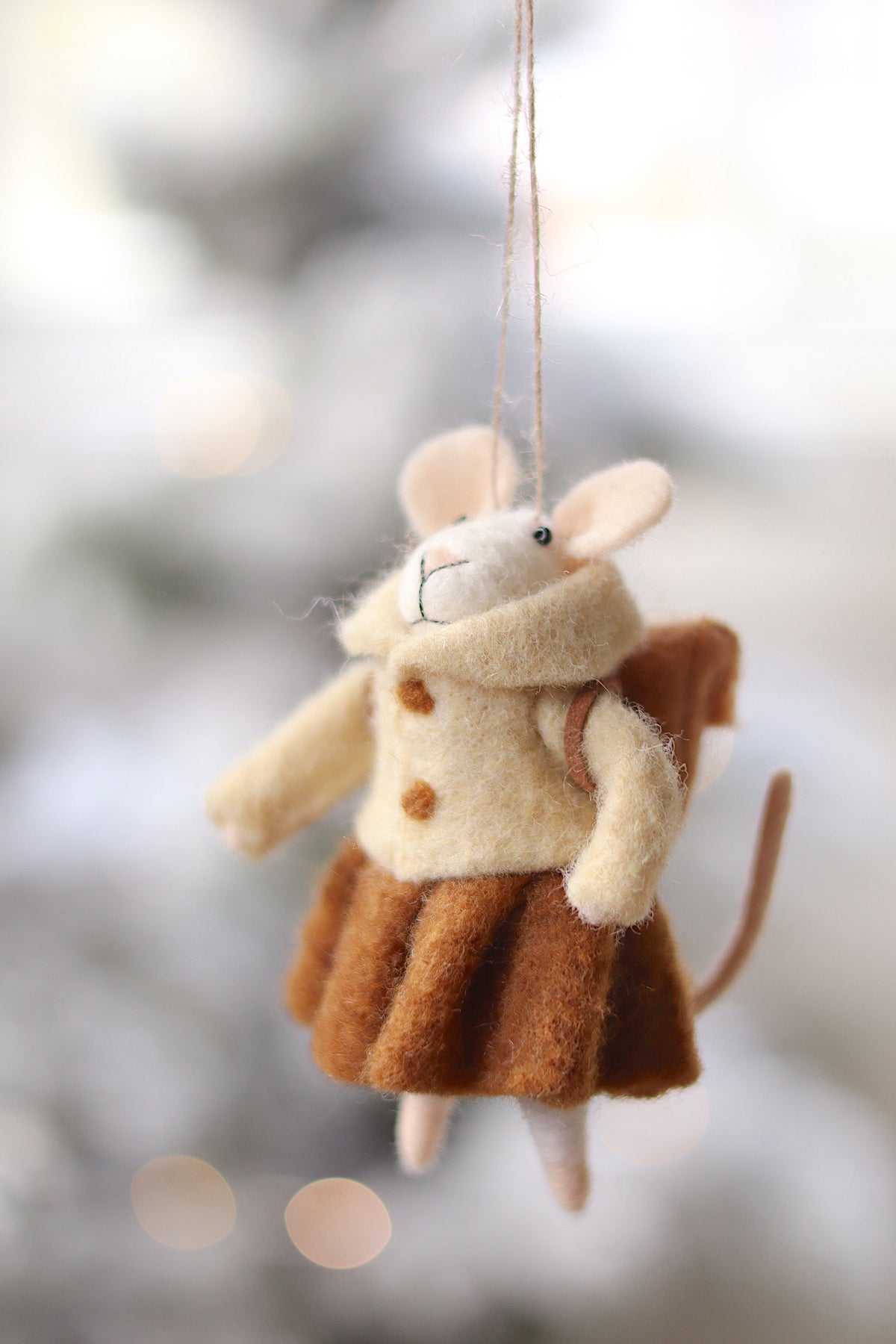 lifestyle view of student sally Scholar Holiday Ornament at Maison garçonne