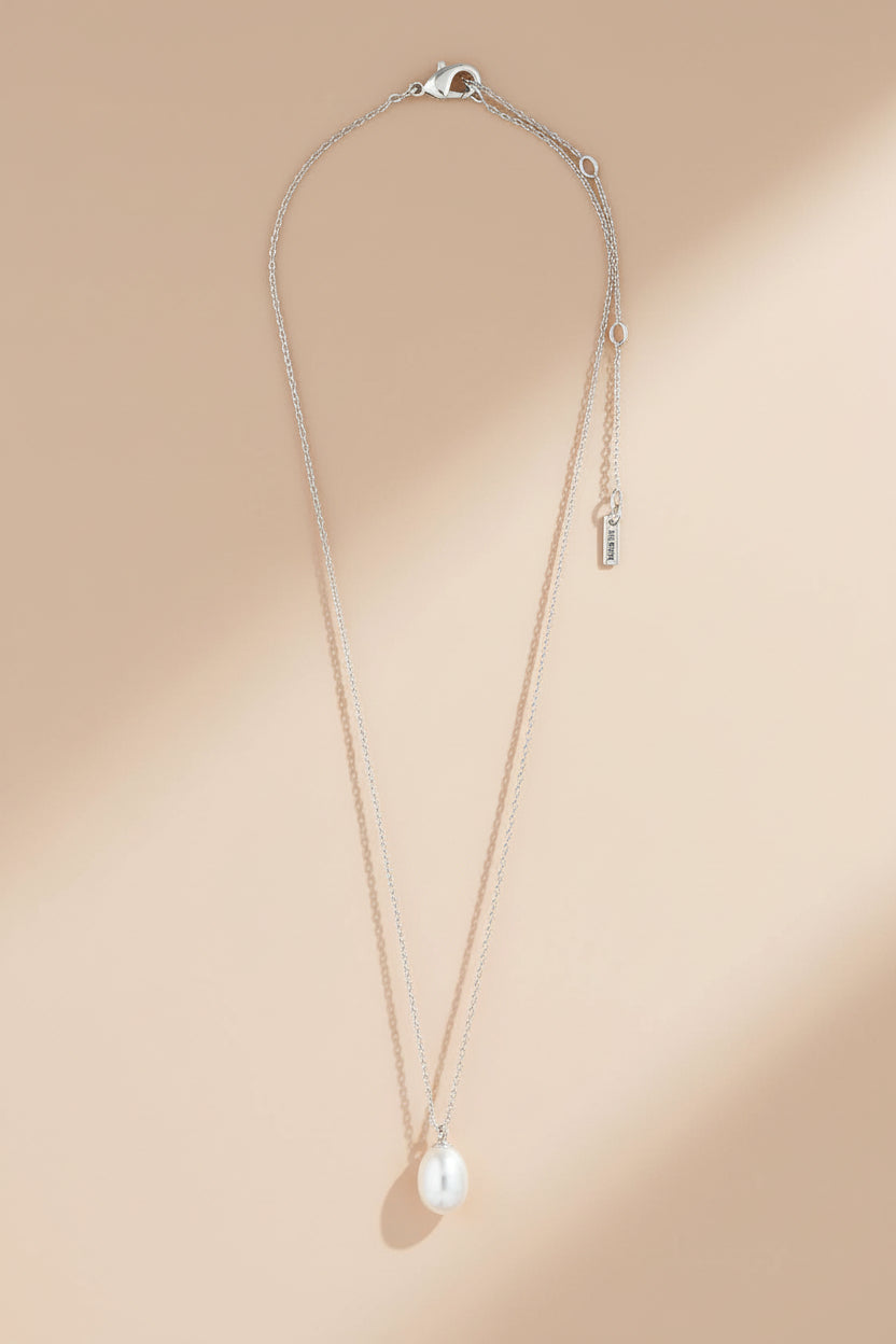 Silver necklace with a pearl pendant from Pilgrim available at la petite garçonne