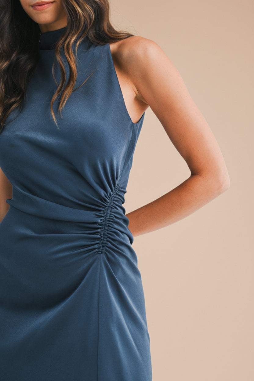 Close-up of a woman wearing the Alberta Navy Maxi Dress with a high neckline from Boutique 1861.