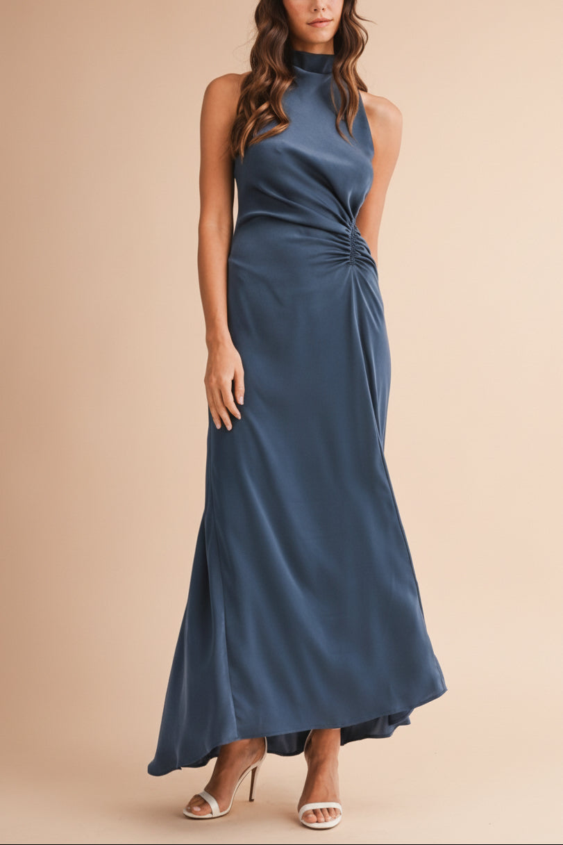 Front view of a woman wearing the Alberta Navy Maxi Dress with a high neckline from Boutique 1861