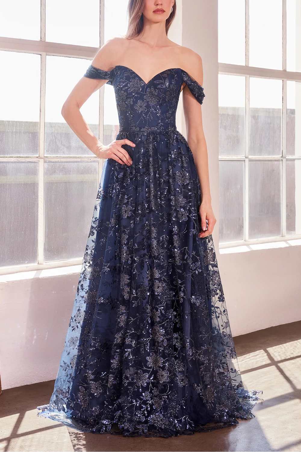 women wearing Alienor navy Glittery Off the Shoulder Maxi Dress from Boutique 1861