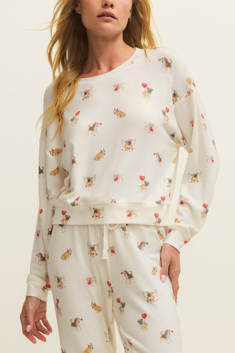 front of a woman wearing Almora White Long Sleeves Top with Dog Print from La petite garçonne