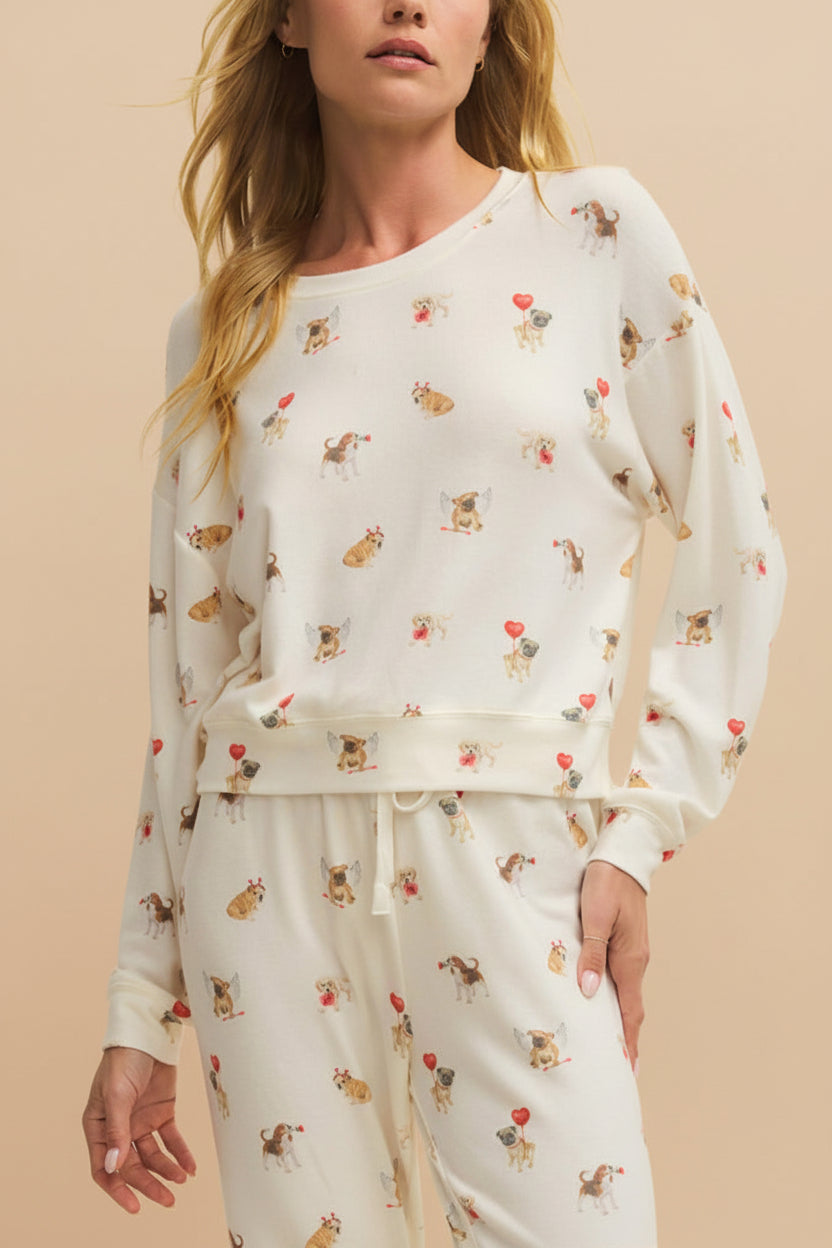 front of a woman wearing Almora White Long Sleeves Top with Dog Print from La petite garçonne