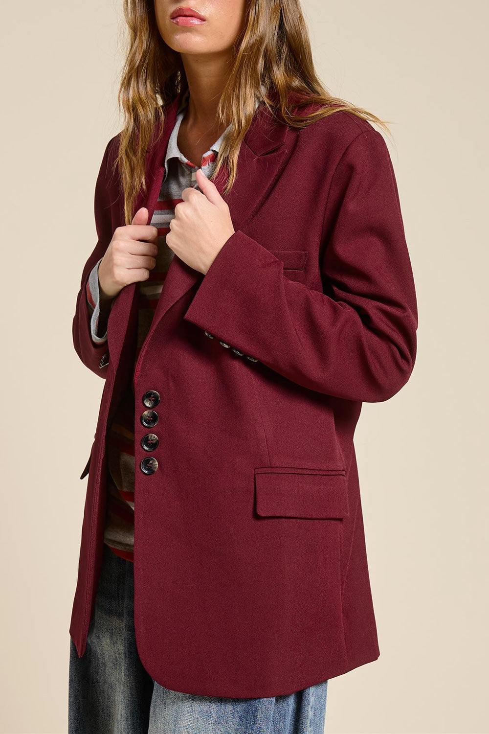 side of a woman wearing Aosta Burgundy Oversized Blazer with Back-Tie from La petite garçonne
