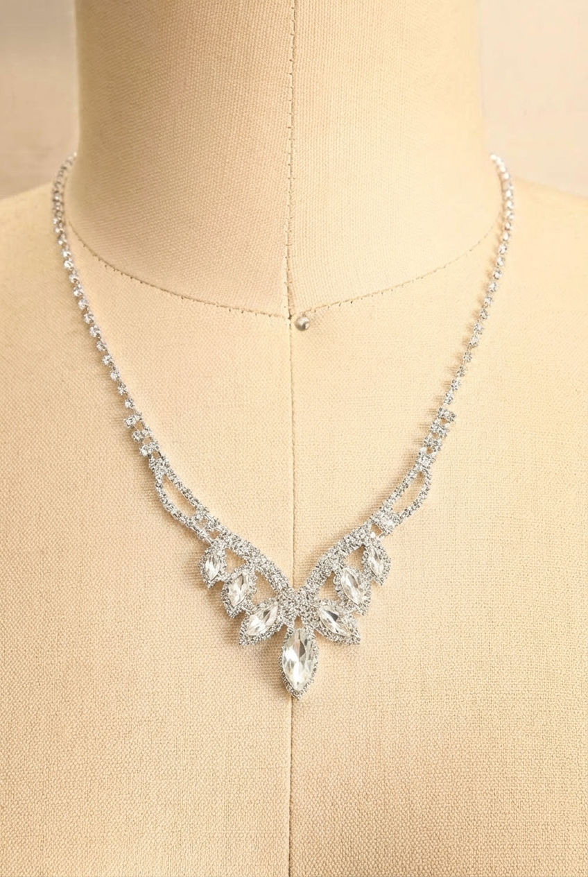 Close-up of a silver gemstone earrings and a matching necklace called Artee from boutique 1861.