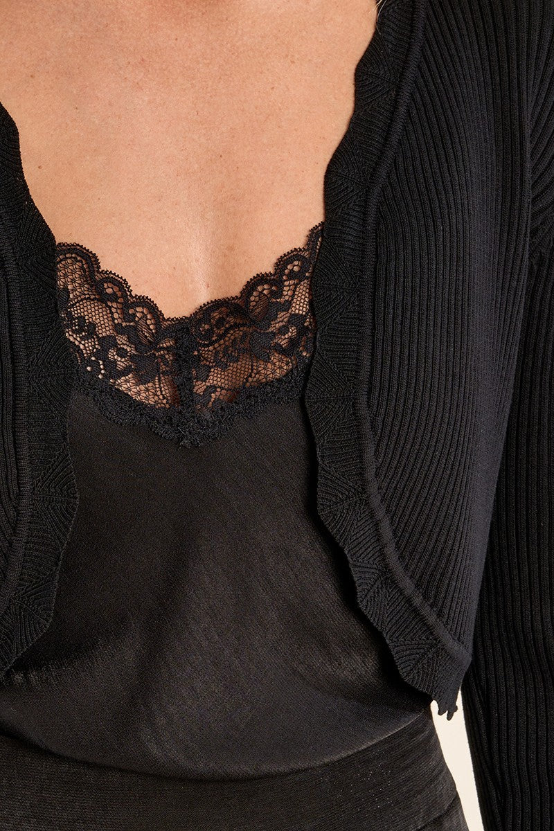 close-up of Averie Black Cropped Knit Bolero with Scalloped Edges from boutique 1861.