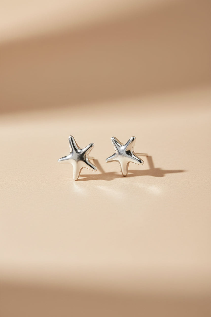 Star-shaped silver earrings Bacoor Silver by Pilgrim on a white background