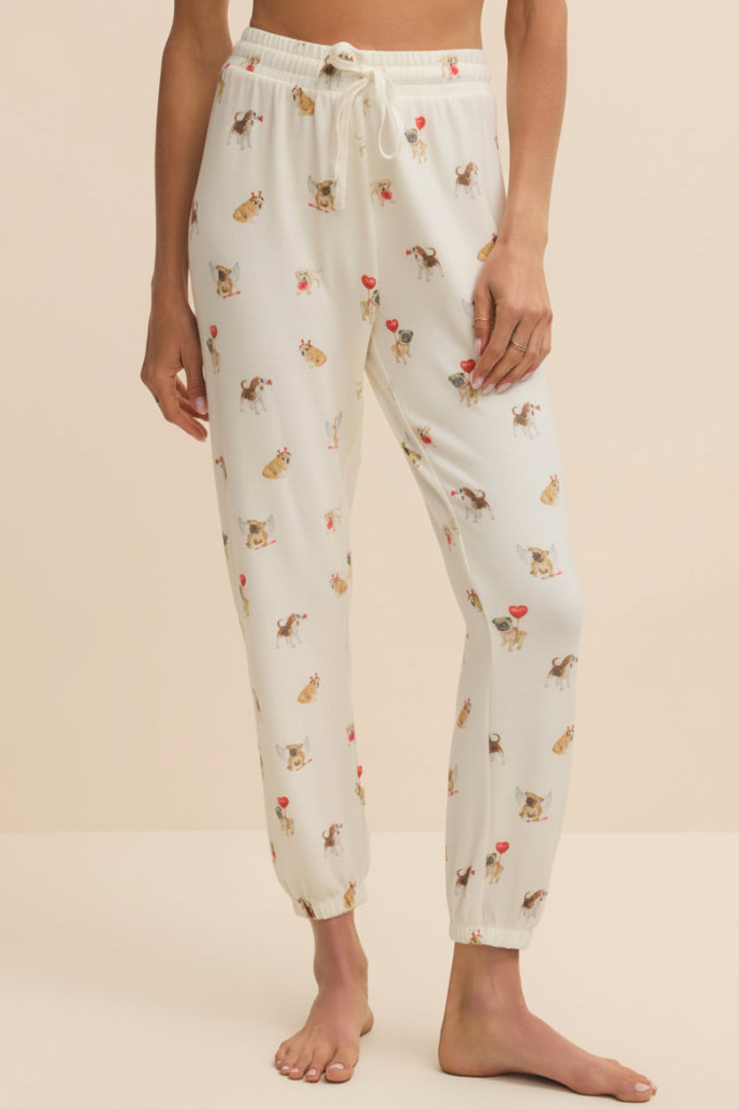 front of a woman wearing Ballari White Jogger Pants with Dog Print from La petite garçonne