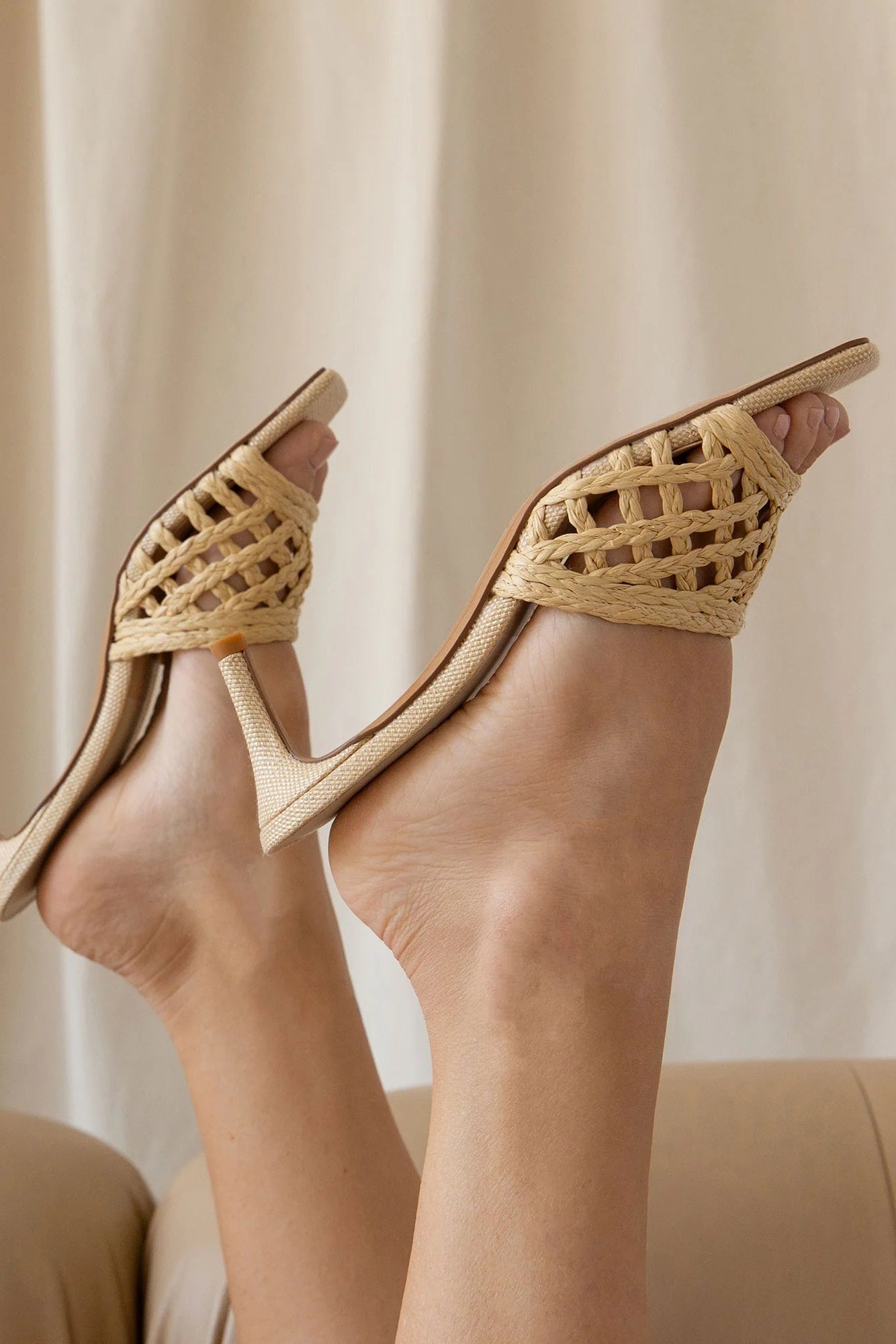 woman wearing Dolce Vita Boween beige Braided Faux Leather Kitten Heel Mules from la petite garçonne.