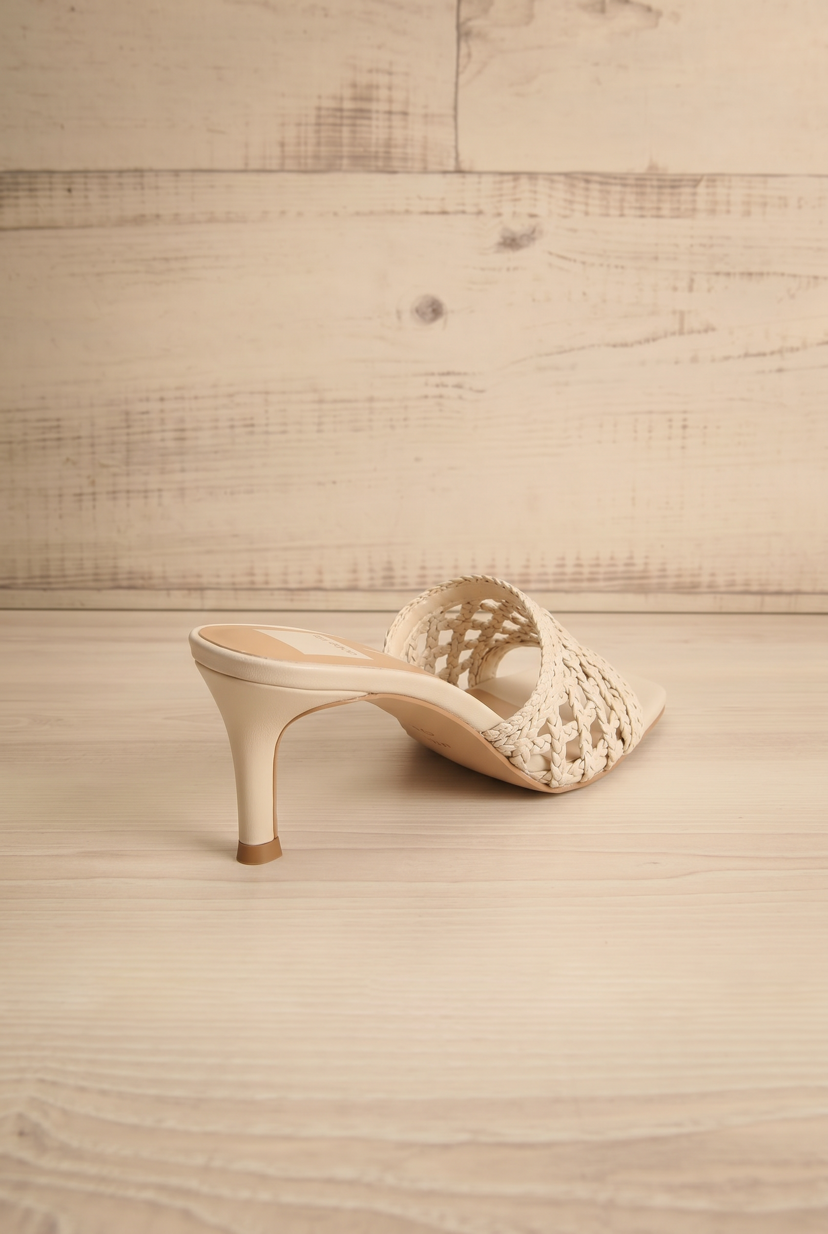 back view of Dolce Vita Boween Ivory Braided Faux Leather Kitten Heel Mules from la petite garçonne.