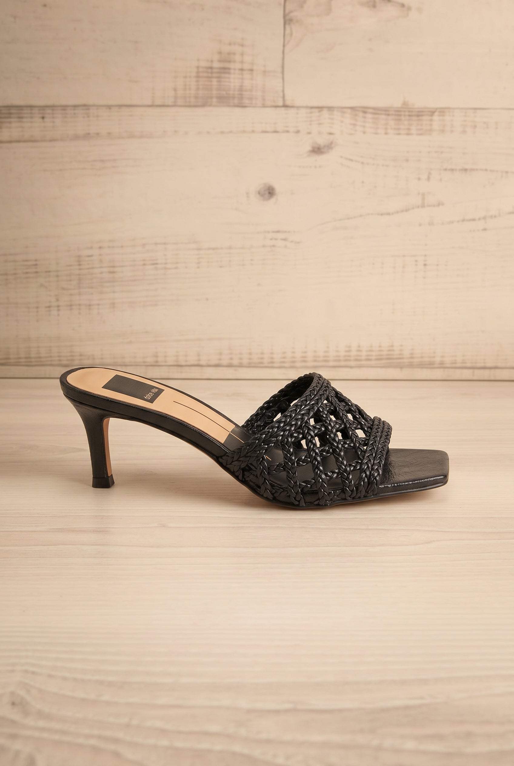 Side view of Dolce Vita Boween black Braided Faux Leather Kitten Heel Mules from la petite garçonne.