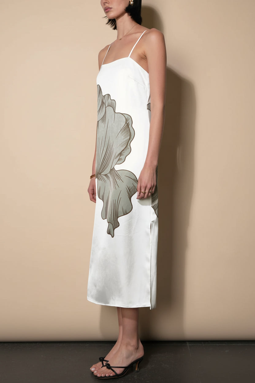 side of a woman wearing Brynlee Ivory Midi Satin Dress with Leaf Motif from Boutique 1861