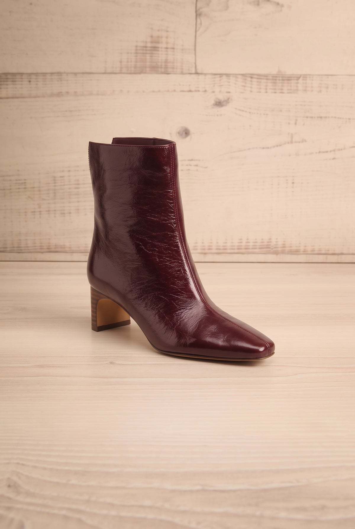Profile view of a single pointed-toe Bennet Burgundy Leather Ankle Boot from Dolce Vita at la petite garçonne in Montreal