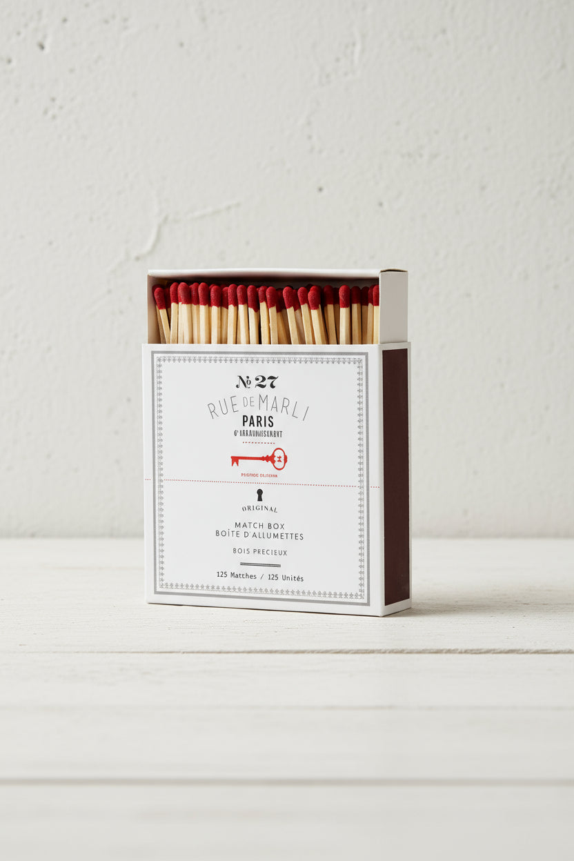Matches in a box with 'Rue de Marly' branding on a white background