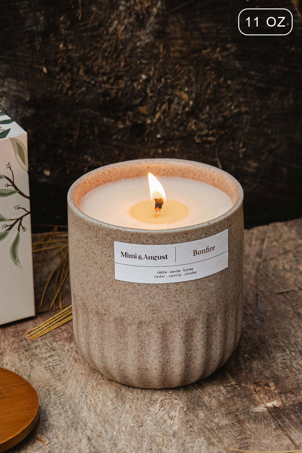 Bonfire 11 0z Reusable Candle with the enchanting scent of cedarwood and smoked vanilla from Mimi & August