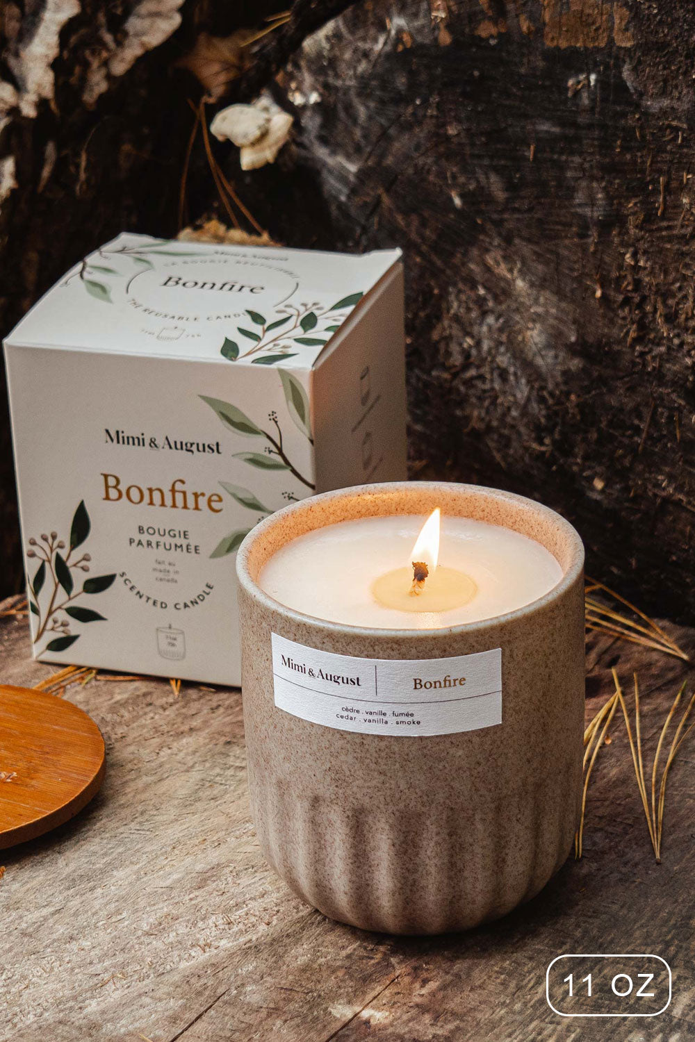 Bonfire 11 0z Reusable Candle with the enchanting scent of cedarwood and smoked vanilla from Mimi & August
