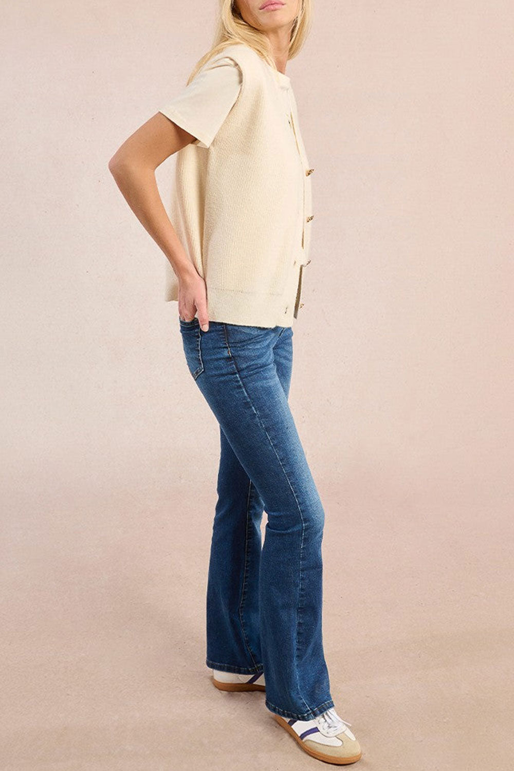 Woman wearing Castelo Ivory Sleeveless Knit Vest from La petite garçonne close out
