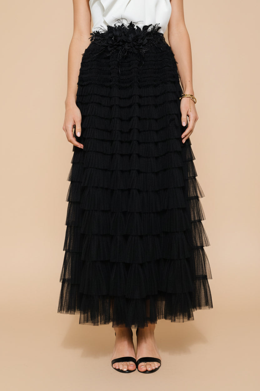 front close-up of a woman wearing Christabel Black Ruffled Maxi Skirt with 3D Flowers from Boutique 1861