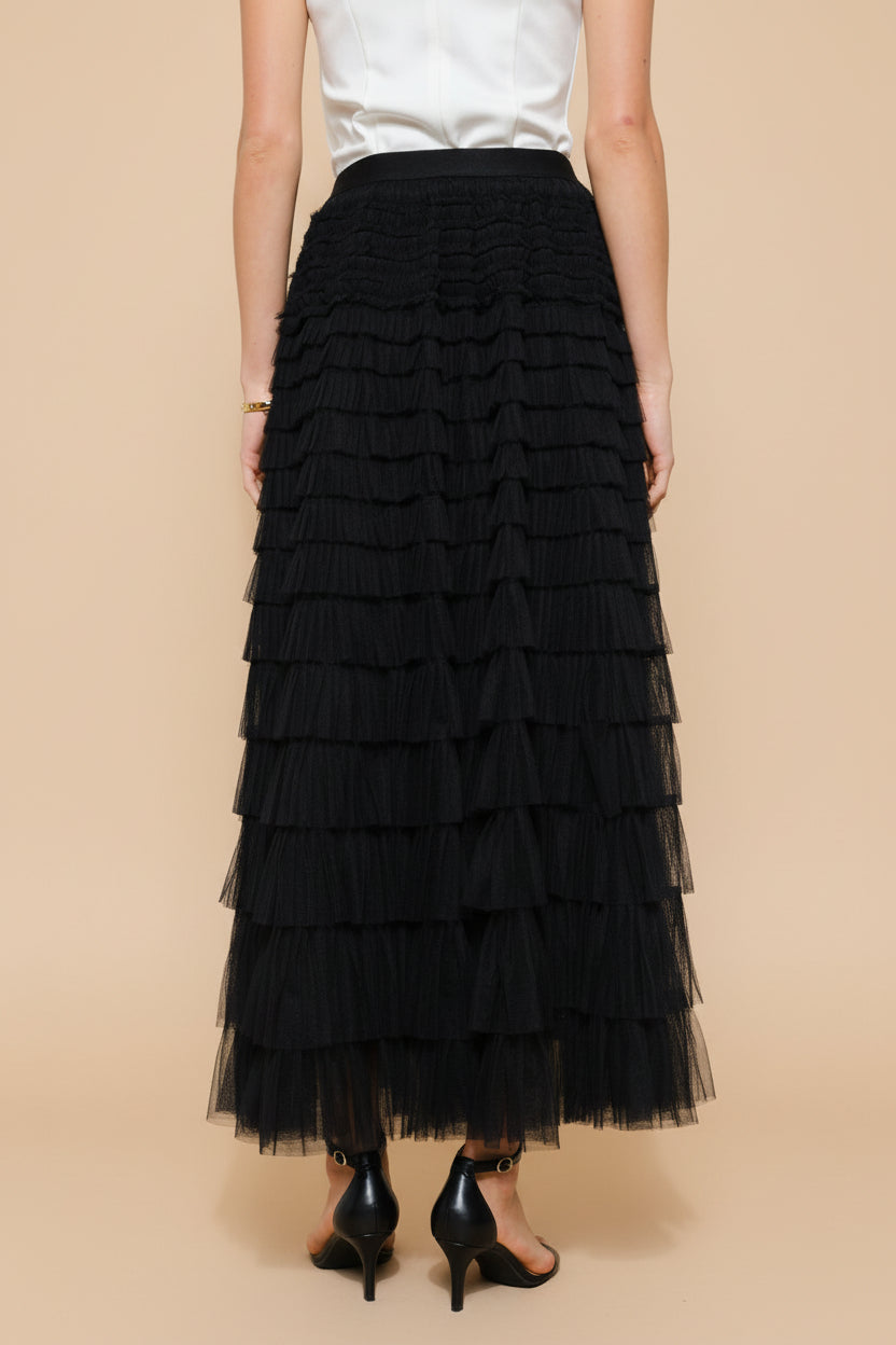 back close-up of a woman wearing Christabel Black Ruffled Maxi Skirt with 3D Flowers from Boutique 1861