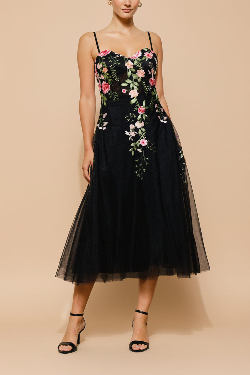 front view of a woman wearing Claree Black Corset Tulle Midi Dress with Floral Embroidery from Boutique 1861