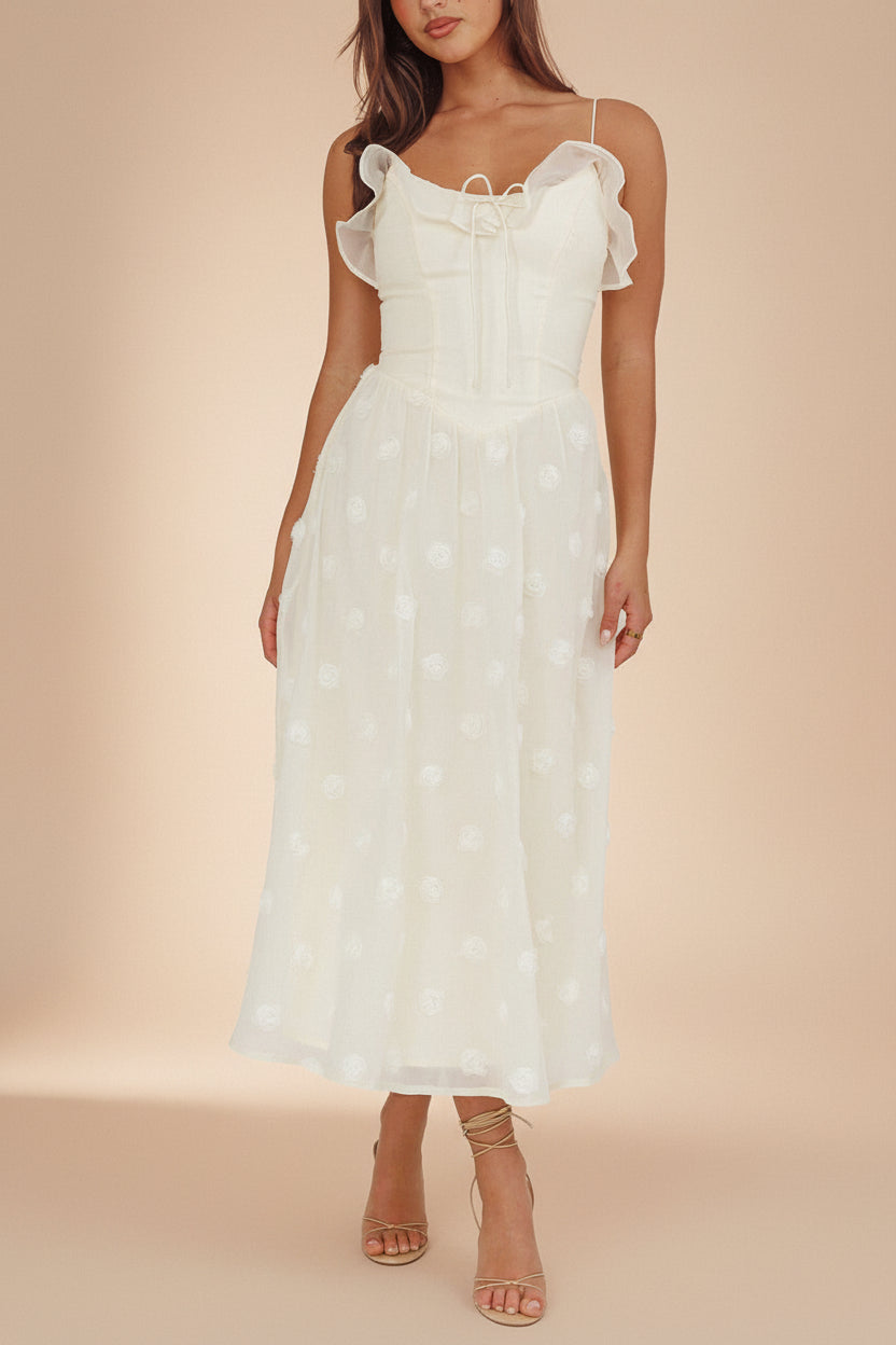 front of a woman wearing Claribel Cream Midi Dress with Floral-Embellishment from Boutique 1861