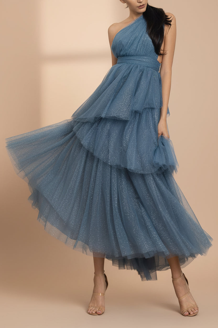 a woman in mouvement wearing Cody Blue Grey Maxi One Shoulder Dress with Glitters from Boutique 1861