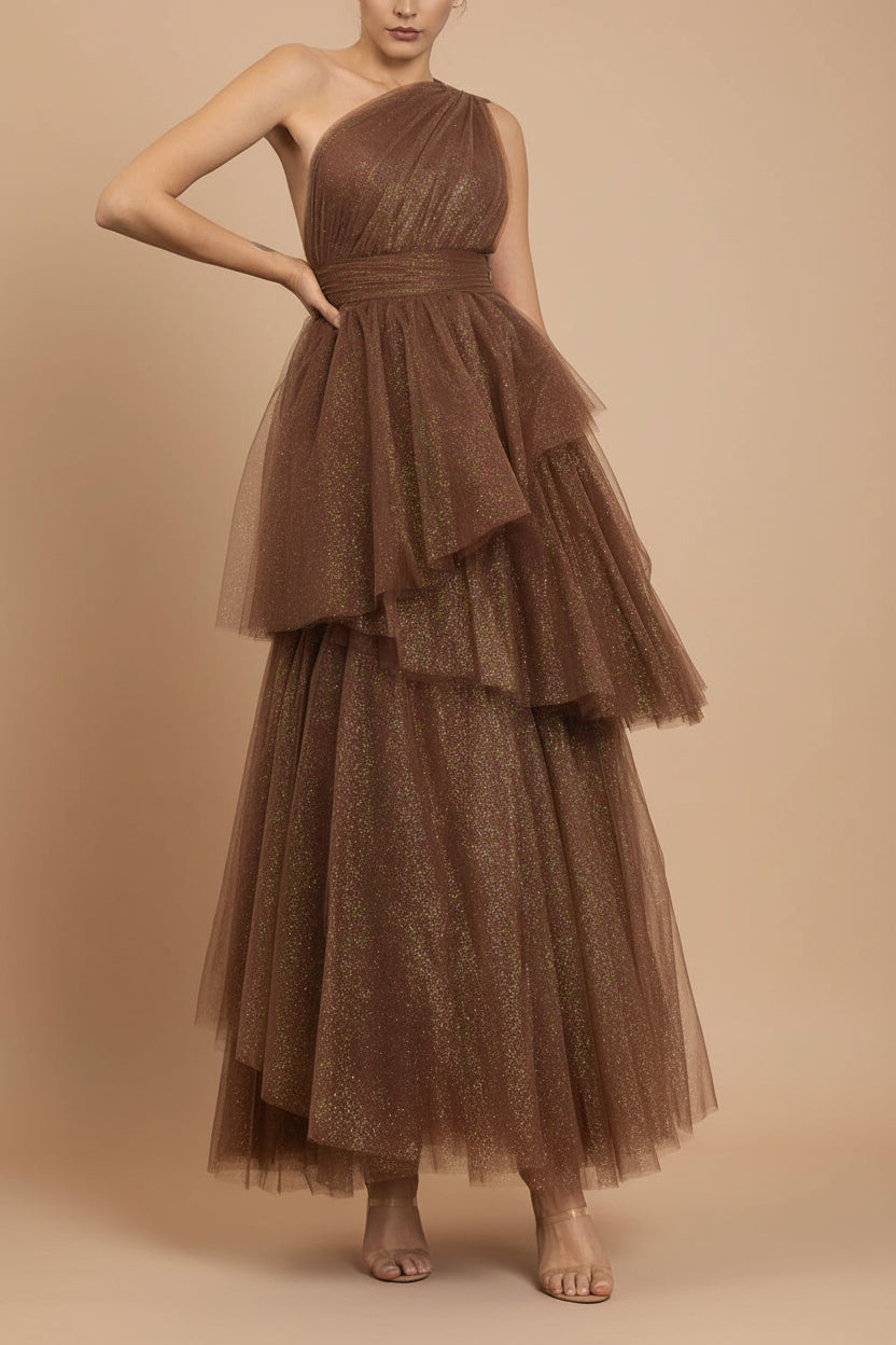 front of a woman wearing Cody Brown Maxi One Shoulder Dress with Glitters from Boutique 1861