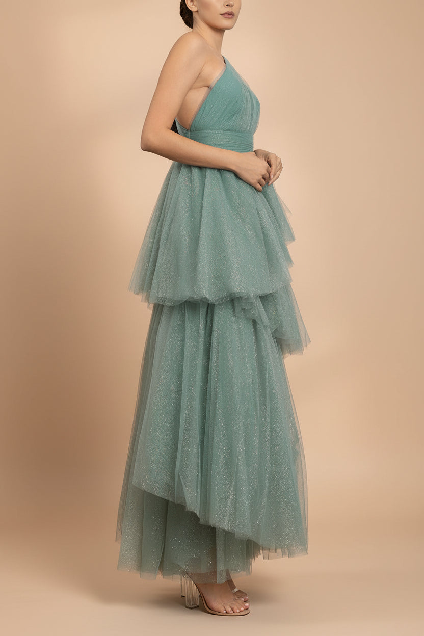side view of a woman wearing Cody Teal Maxi One Shoulder Dress with Glitters from Boutique 1861