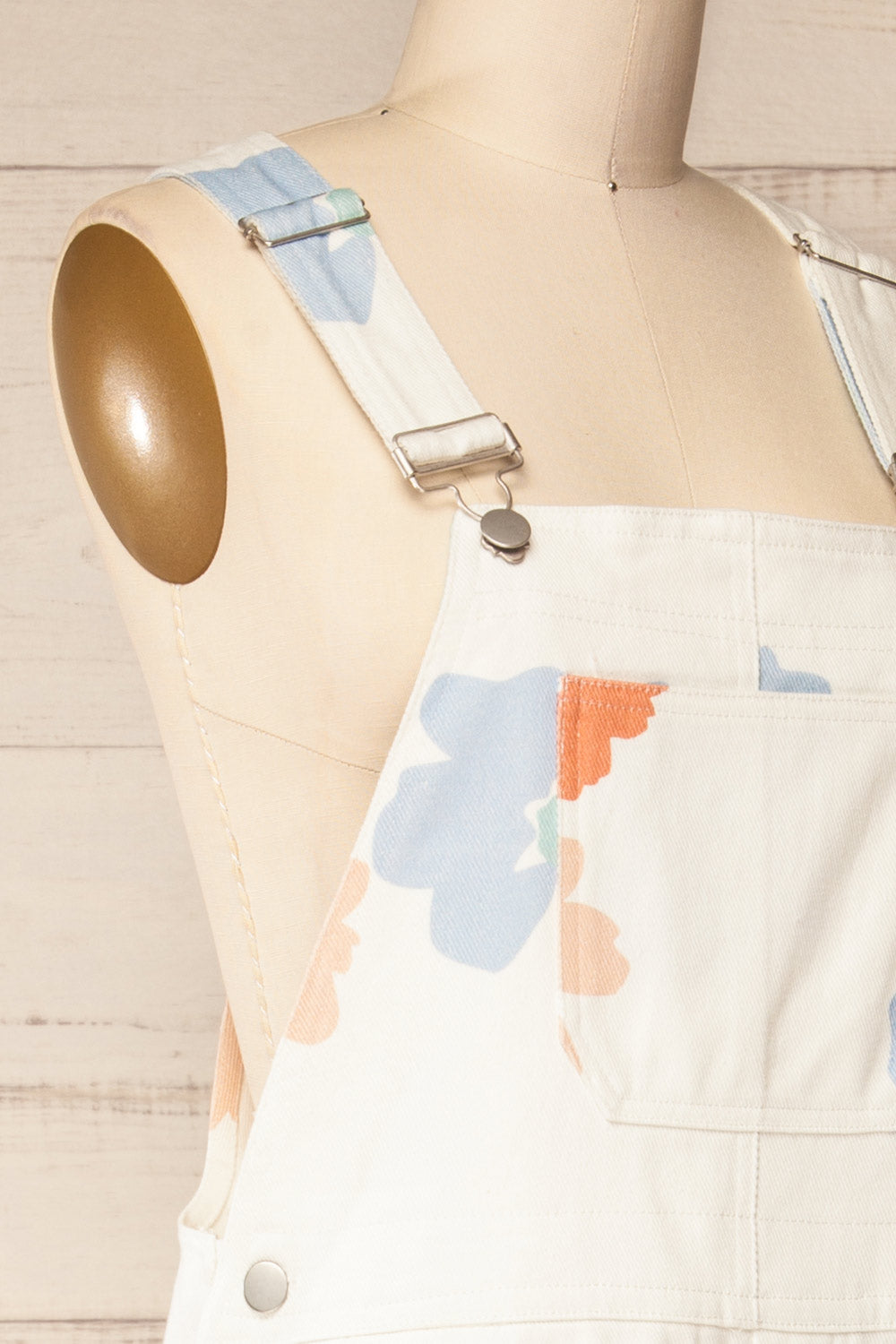 Claudius White Floral Denim Overalls | La petite garçonne side close-up
