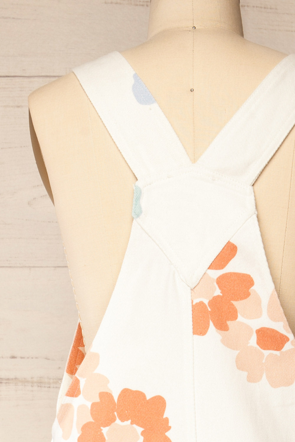 Claudius White Floral Denim Overalls | La petite garçonne back close-up