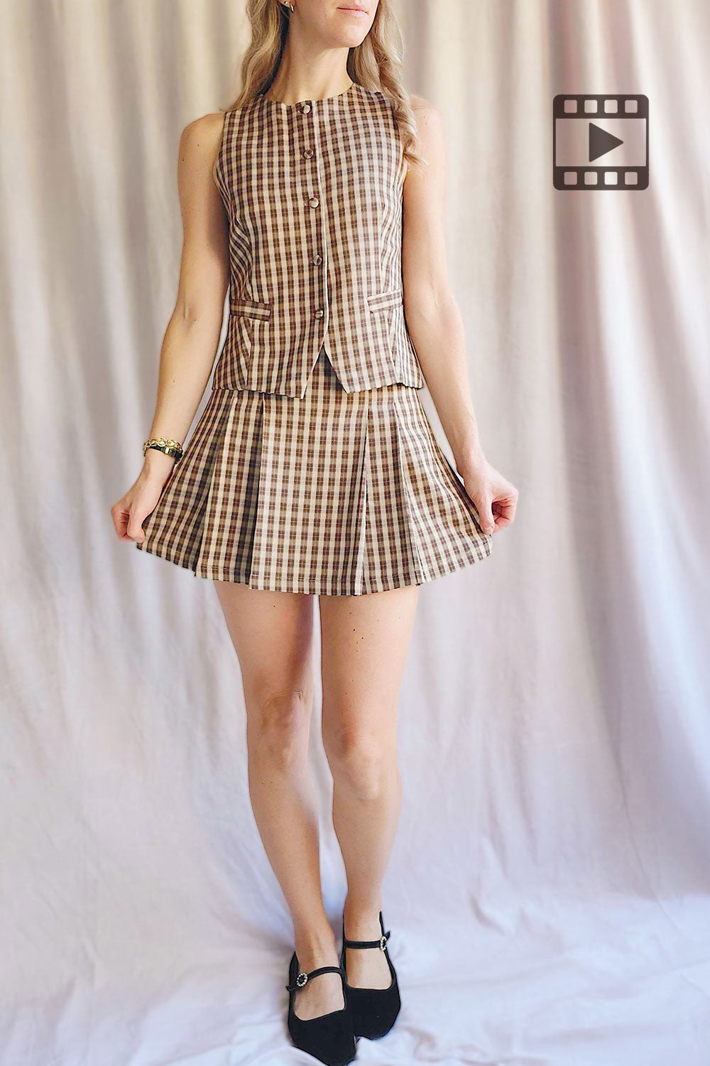 Person wearing Carince Brown Plaid Button Down Vest from La petite garçonne