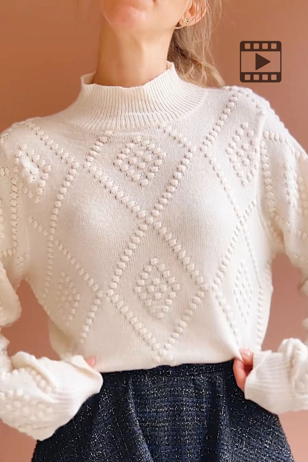 Person wearing Kumari Textured Ivory Knit Sweater from Boutique 1861