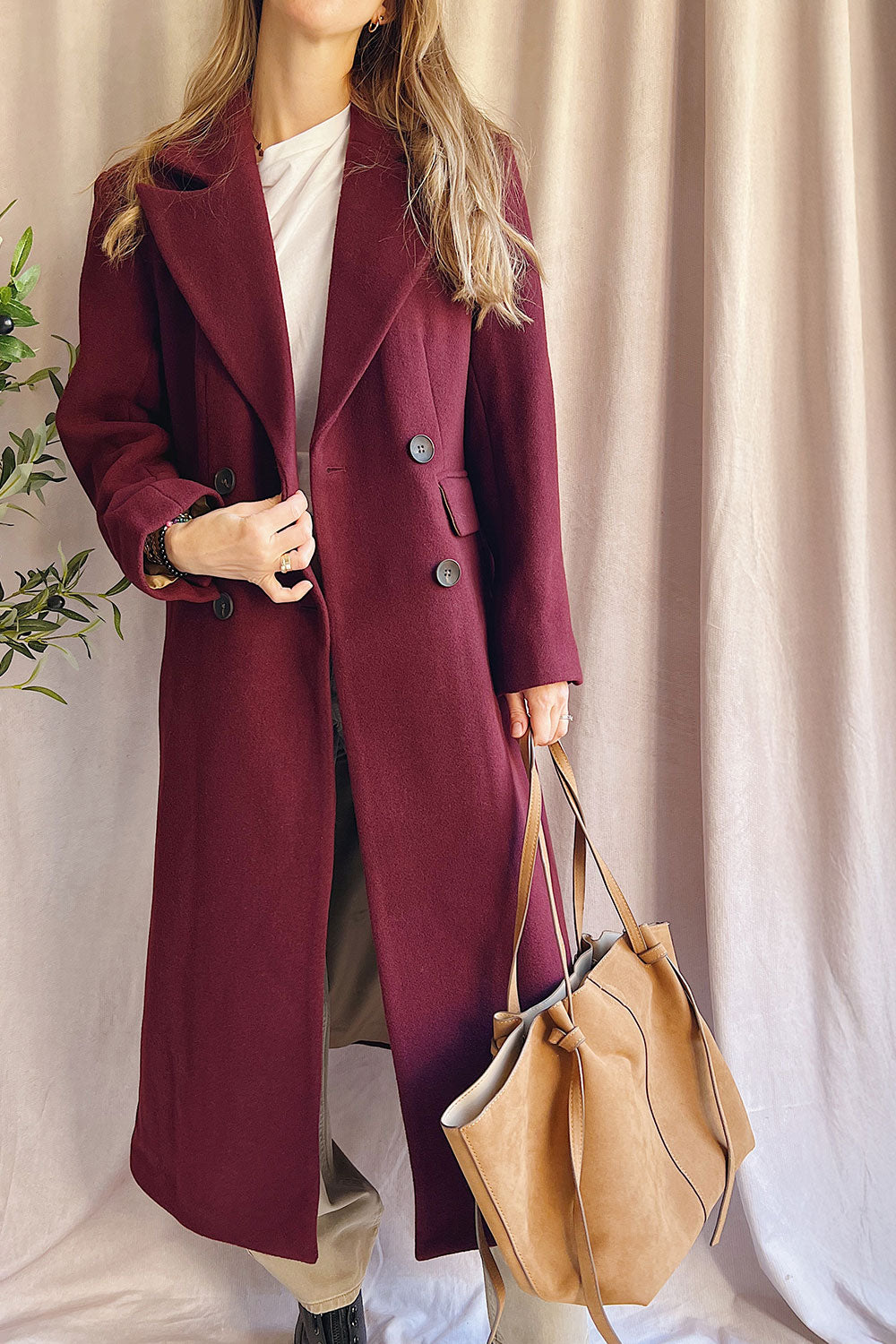 Person wearing Lagos Long Burgundy Coat from La petite garçonne