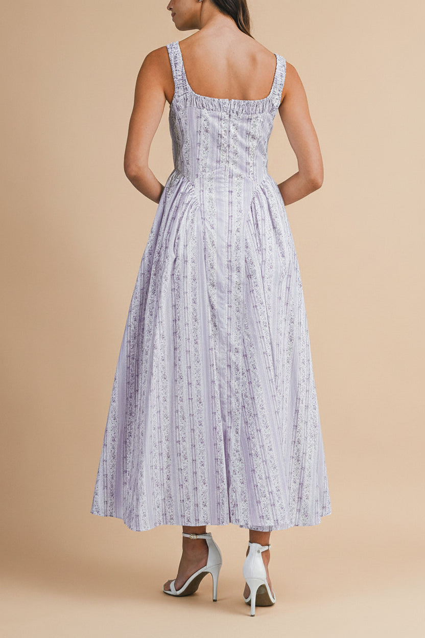 back view of a woman wearing Daiko Lilac Floral A-Line Maxi Dress with Corset Bust from Boutique 1861