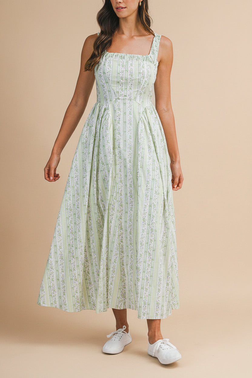 view of a woman wearing Daiko Green Floral A-Line Maxi Dress with Corset Bust from Boutique 1861
