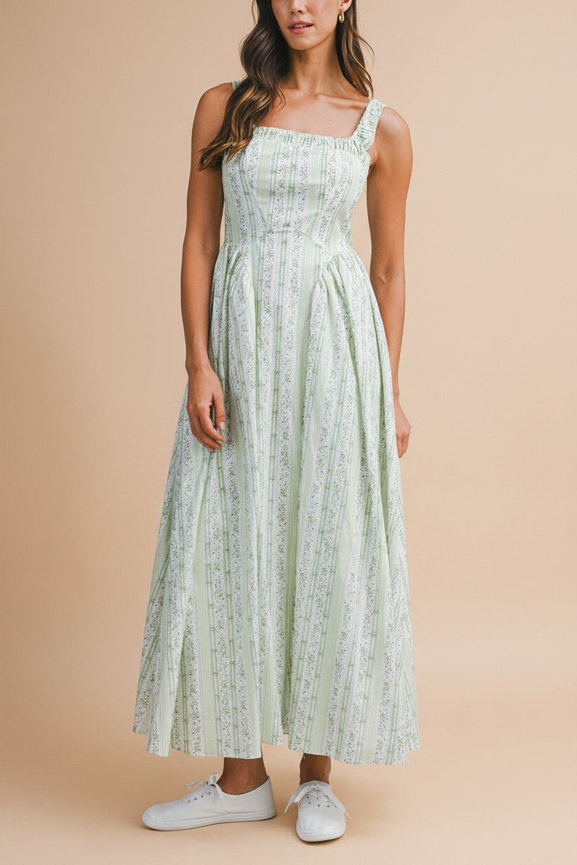 front view of a woman wearing Daiko Green Floral A-Line Maxi Dress with Corset Bust from Boutique 1861