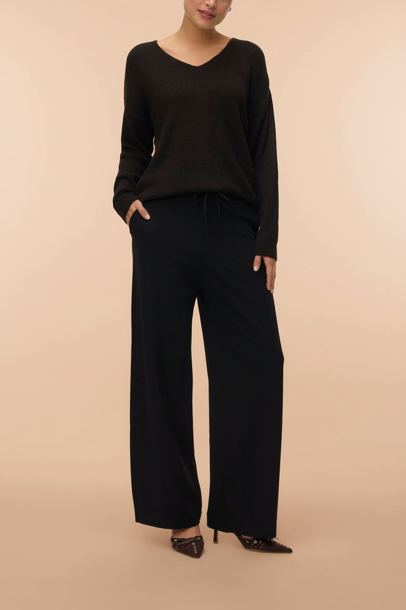 front of a woman wearing Daman Black Wide Leg Pants from La petite garçonne