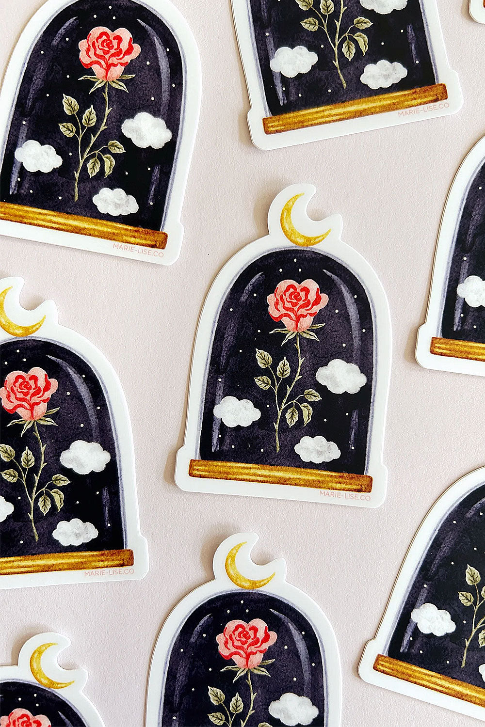 Decorative stickers with a rose inside a glass dome, moon, and clouds from Marie-Lise