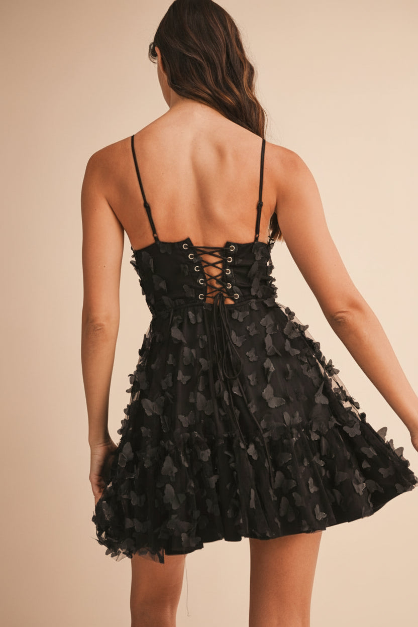 back of women wearing Faya Black Short Corset Dress with Butterflies From Boutique 1861
