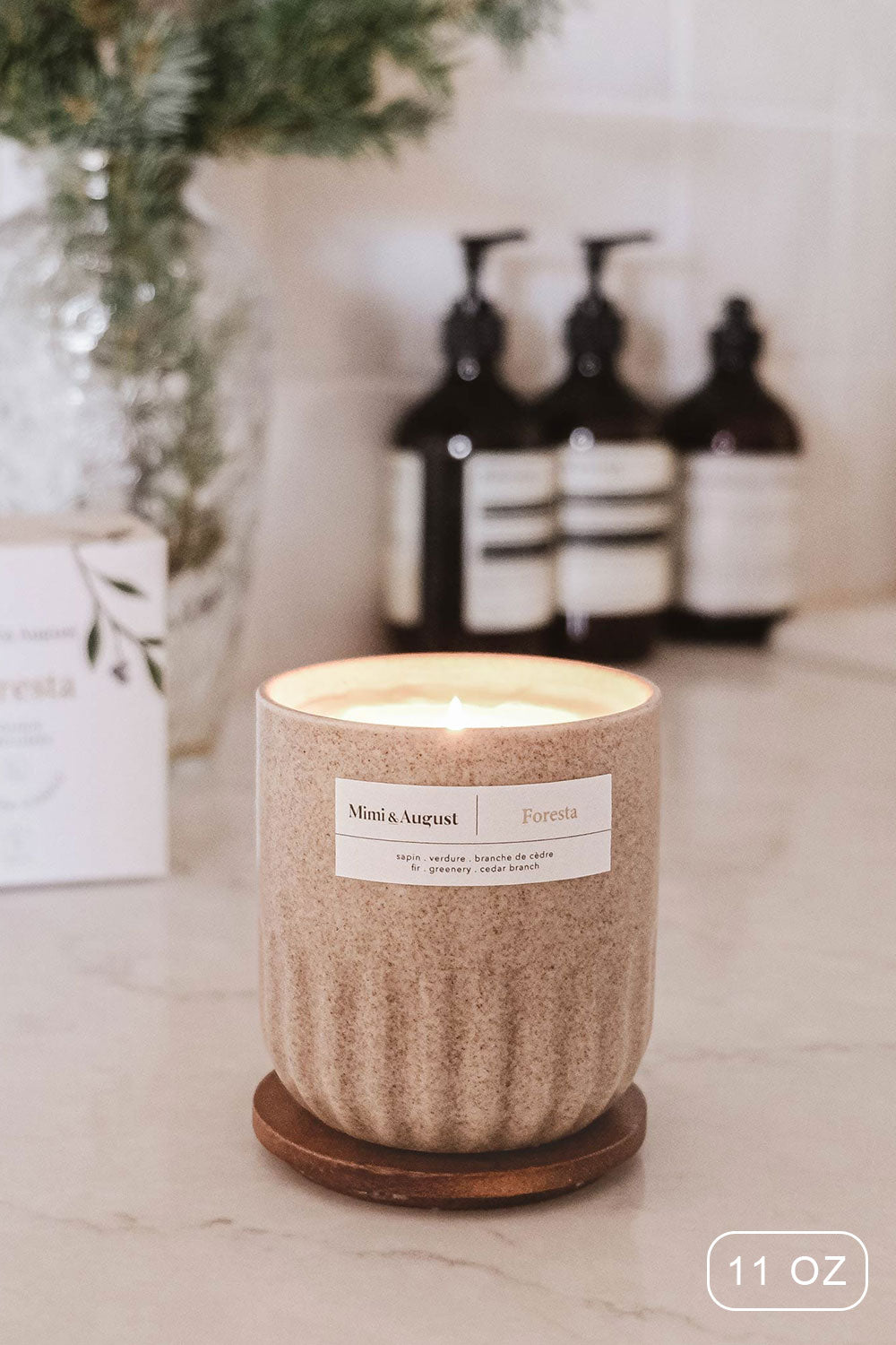 Reusable candle 11 oz fills with the strong scent of the forest from Mimi & August