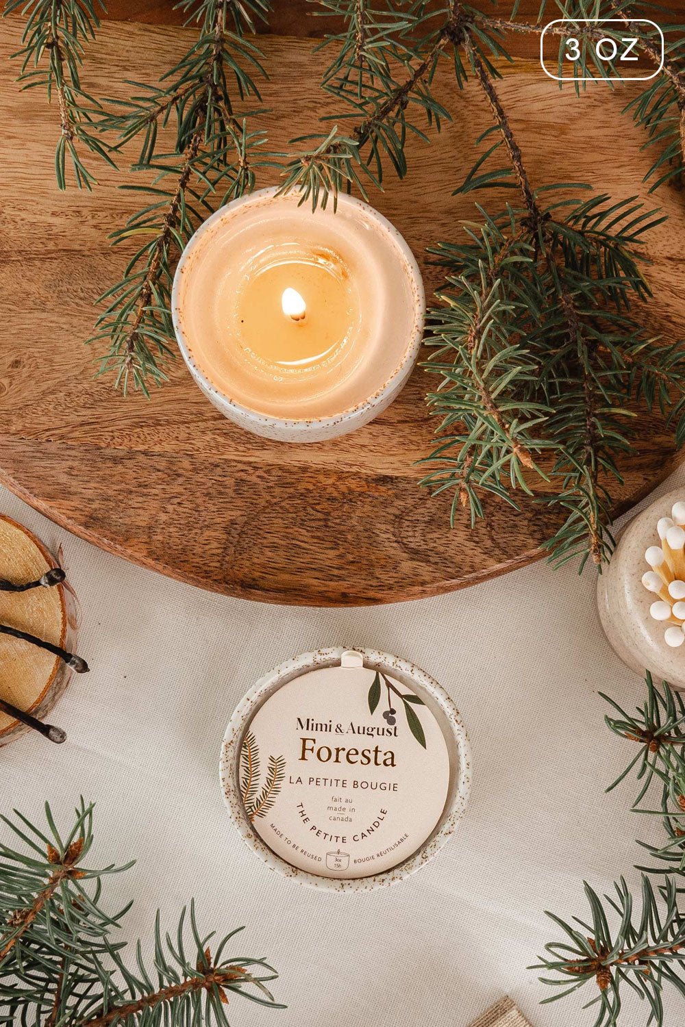 Reusable candle 3 oz fills with the strong scent of the forest from Mimi & August
