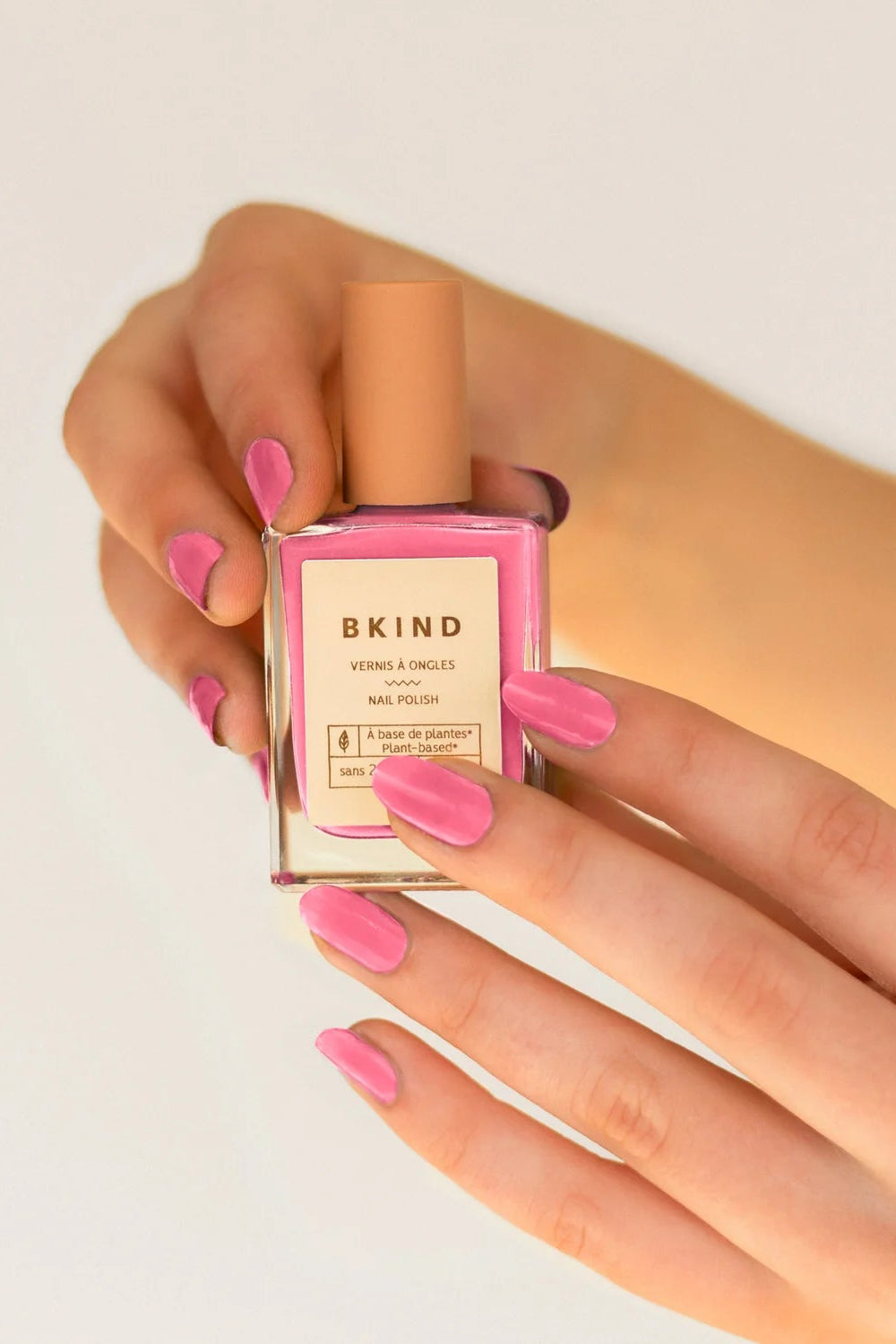Hand holding Nail Polish Gemini by BKIND | La petite garçonne