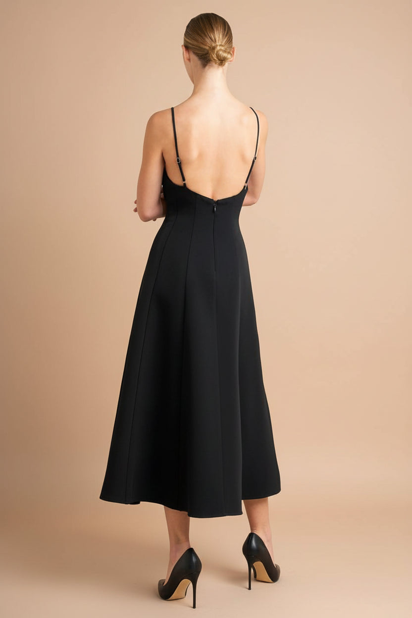 back of a woman wearing Hariette Black A-Line Midi Dress with V-Neck from Boutique 1861