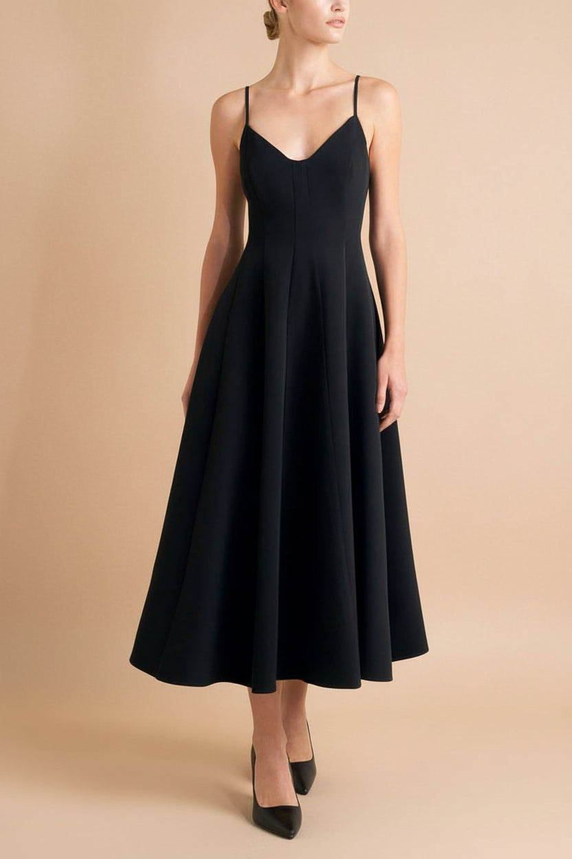 front of a woman wearing Hariette Black A-Line Midi Dress with V-Neck from Boutique 1861