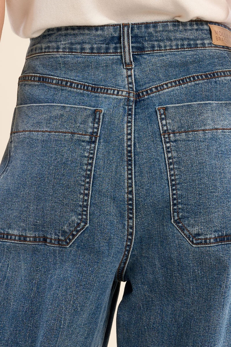 close-up on a woman wearing Hathras Blue Demin Barrel Pants at la petite garçonne