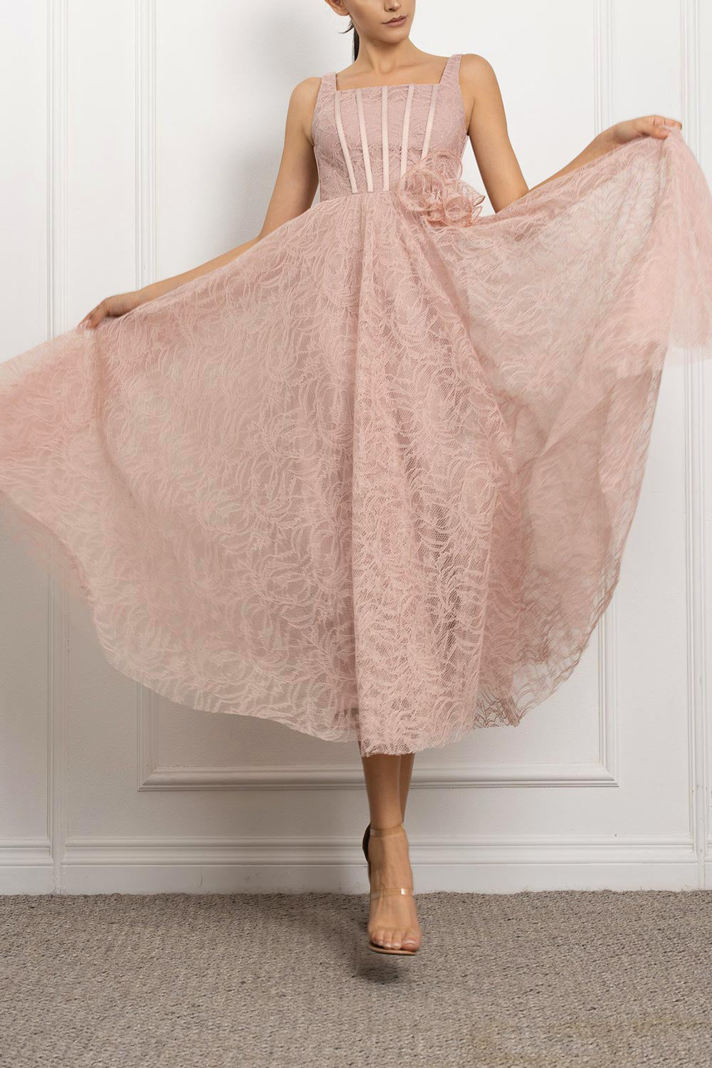 a woman in mouvement wearing Hellis Pink Midi Dress with 3D Flower from Boutique 1861