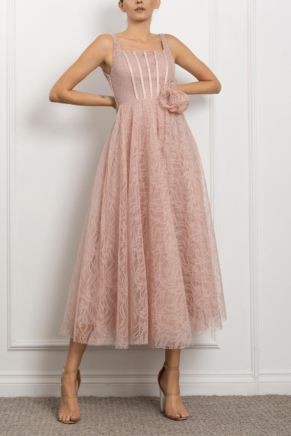 front of a woman wearing Hellis Pink Midi Dress with 3D Flower from Boutique 1861