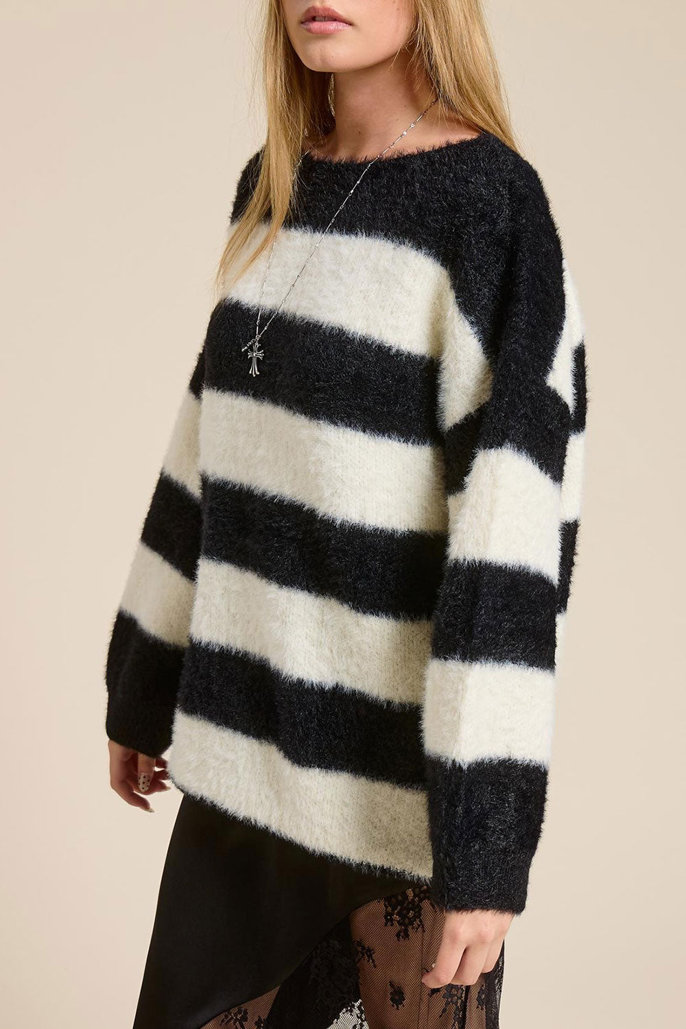 Person wearing Hardin Black Oversized Striped Fluffy Sweater from La petite garçonne side